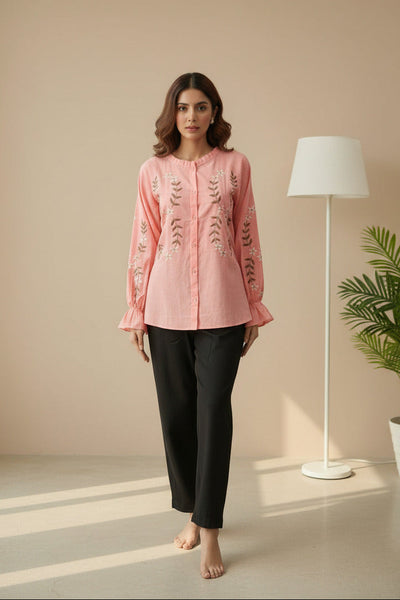 A model wearing a Pink top with floral embroidery