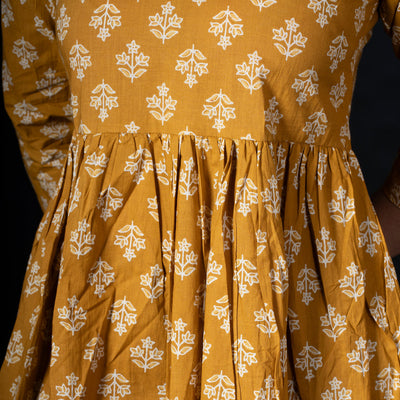 Cotton Peplum Top With V Neck - Mustard